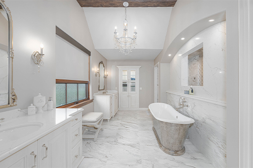 modern bathroom renovation has new ceramic tile, bathtub and vanity installed