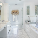 Custom Bathroom Renovations near me in Madisonville, LA St. Tammany Parish with Northshore Renovations and Contractors. Image of a custom-built, clean white bathroom with a bathtub and mirrors, reflecting the latest trends in St. Tammany Parish renovation styles.