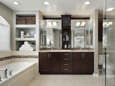 Small bathroom remodel, bathroom renovation in Madisonville, LA by Northshore Renovations & Contracting. Image of a modern bathroom with custom cabinetry, glass shower, and built-in shelving, reflecting the company’s commitment to style, function, and quality craftsmanship.
